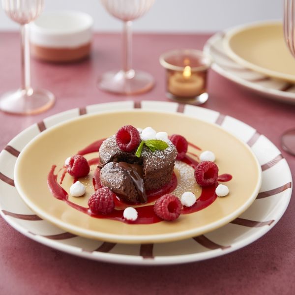 chocolate cupcake with a dripping heart and raspberry coulis.html