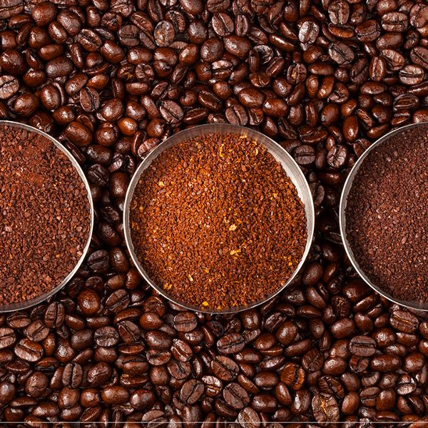 Coffee beans presented in bowls showing the 3 different grind sizes, this photo is taken with coffee beans as background.