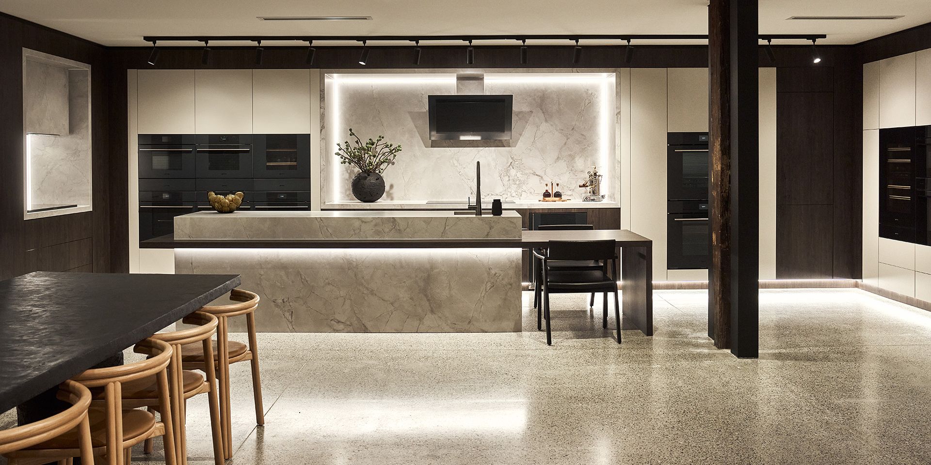 Image of Alexandria showroom in Sydney featuring Linea kitchen with beige cabinetry and marble counters.