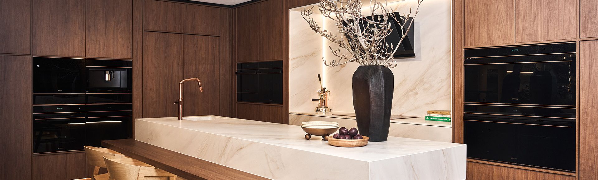 Smeg Alexandria showroom kitchen with dark wood cabinetry and Dolce Stil Novo Products