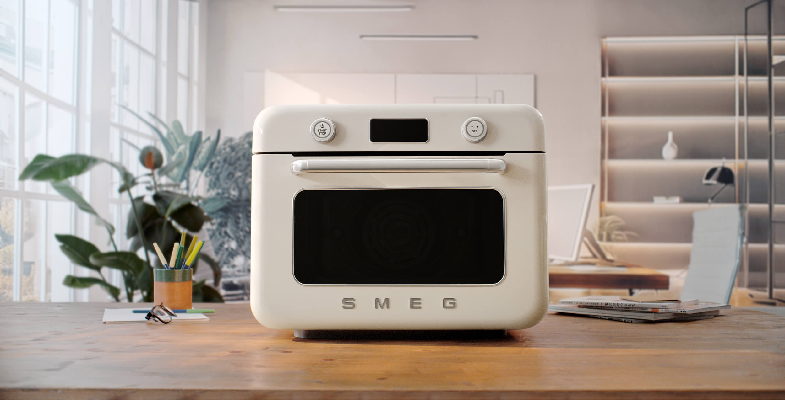 Forno a vapore da appoggio COF01 Smeg di colore panna su piano cucina