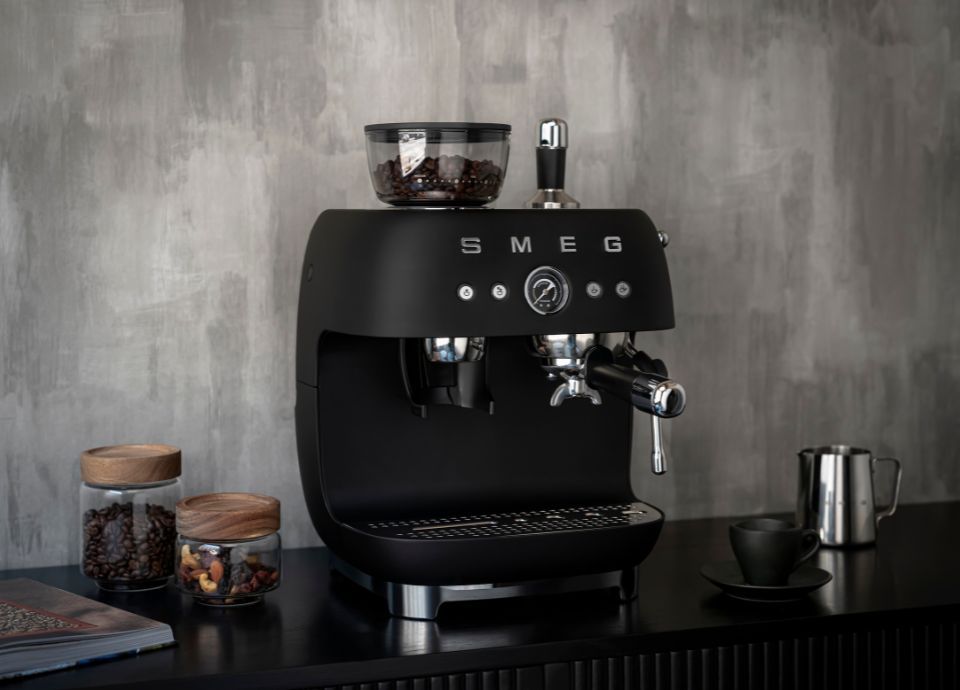 EGF03 in matte black against a grey background and dark cabinetry