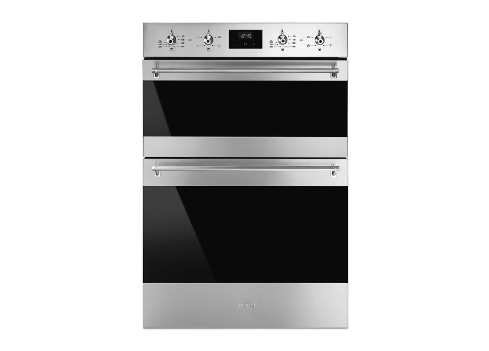 An integrated double oven in stainless steel. Featuring digital display, 4 control dials, and a standard size lower oven with smaller upper oven