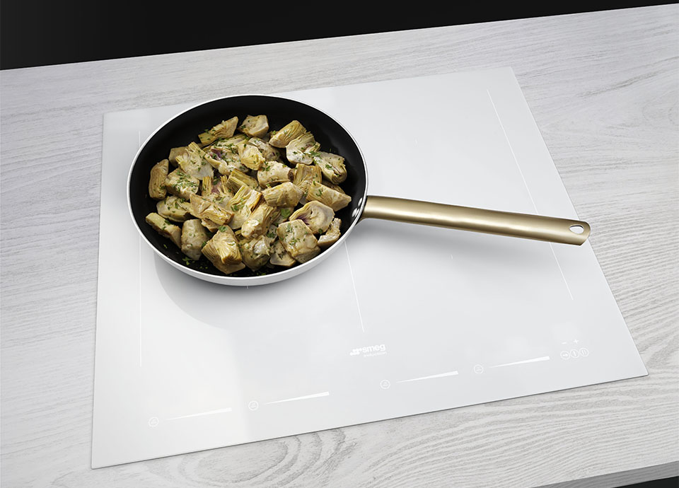 A white Induction hob with a cookware pan on top
