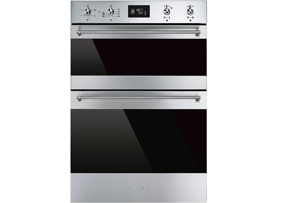 An integrated double oven in stainless steel. Featuring digital display, 4 control dials, and a standard size lower oven with smaller upper oven