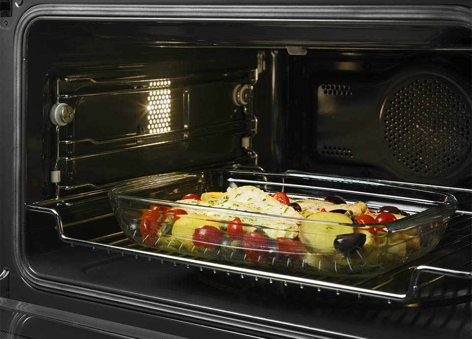 A modern oven which features a built-in microwave oven feature