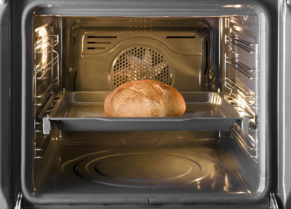 Some delicious looking bread in a proving oven