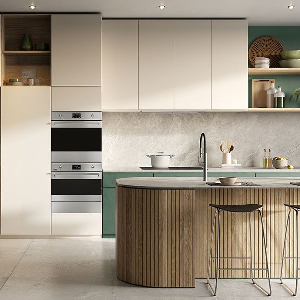 A contemporary kitchen featuring one of Smeg's built-in single ovens (stainless steel) integrated within dark wood floor-to-ceiling kitchen cabinets