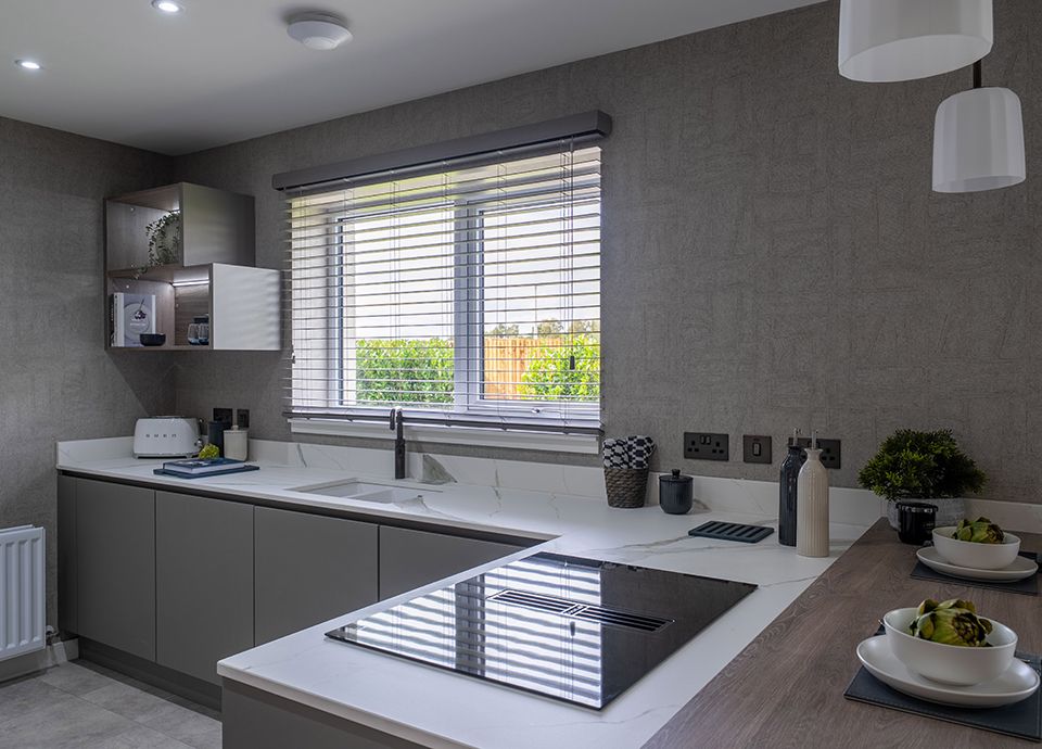 Modern new build kitchen with hob and toaster