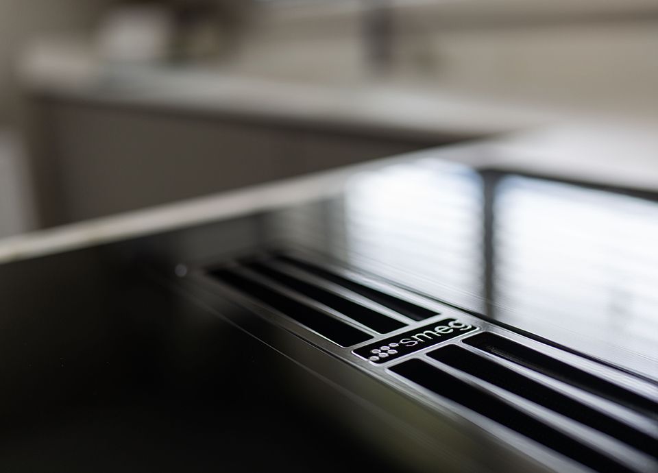 Close up of Smeg built in induction hob with vent