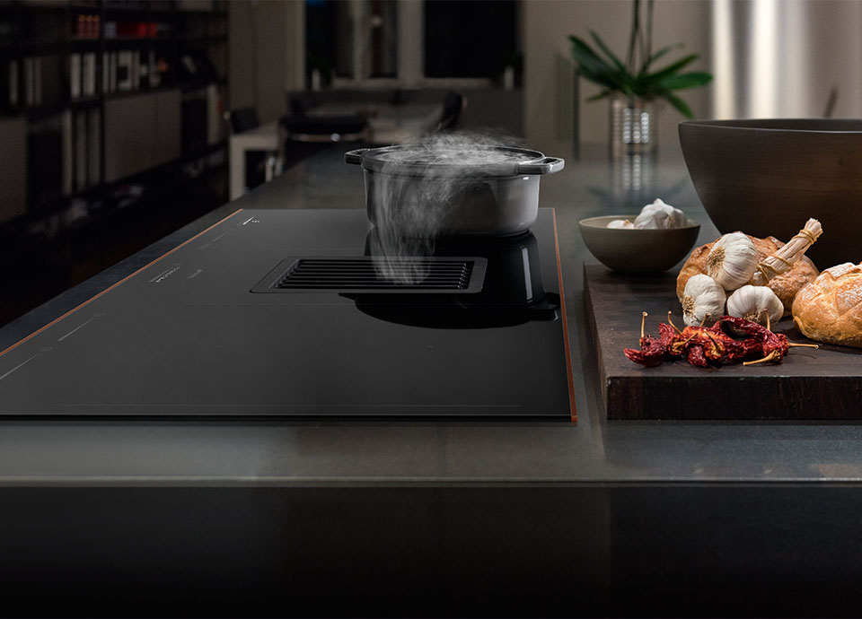 A black Induction hob with built in hood.