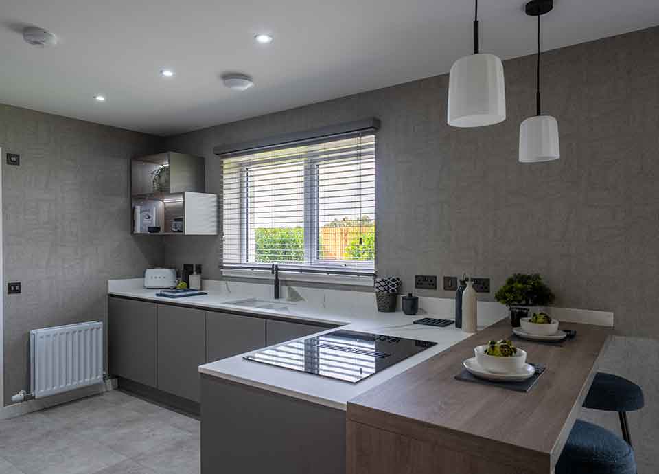 Modern new build kitchen with hob and toaster