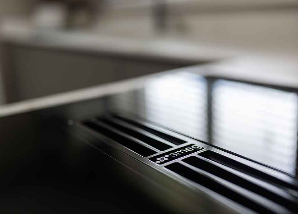 Close up of Smeg built in induction hob with vent