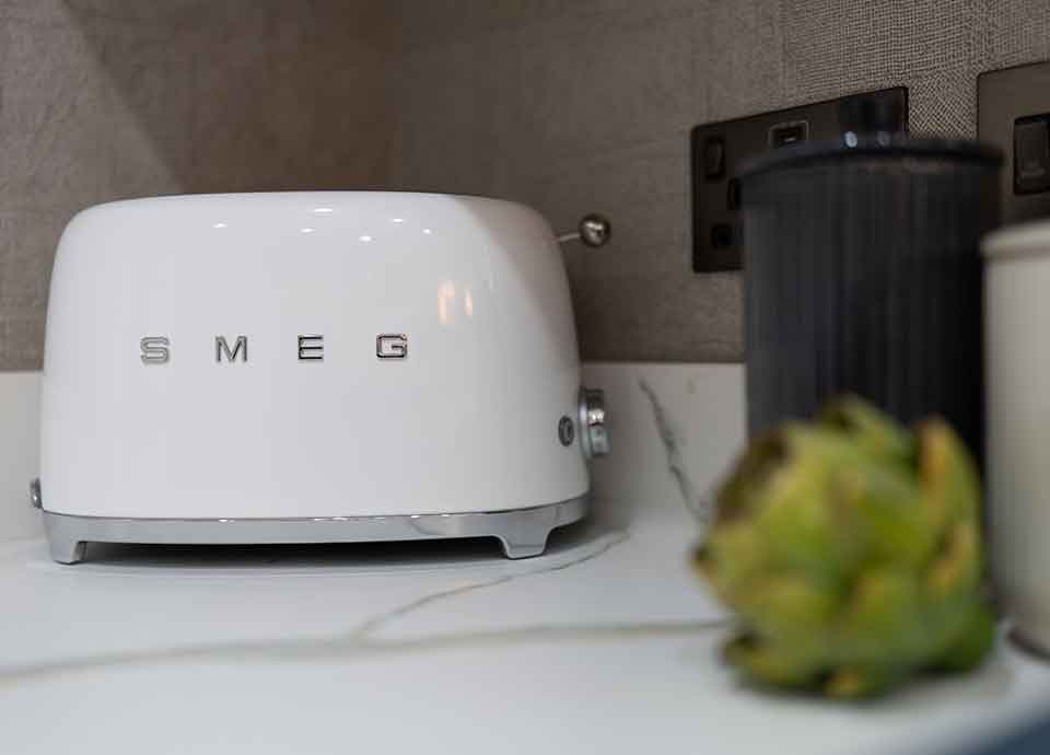 Smeg white toaster on light coloured countertop