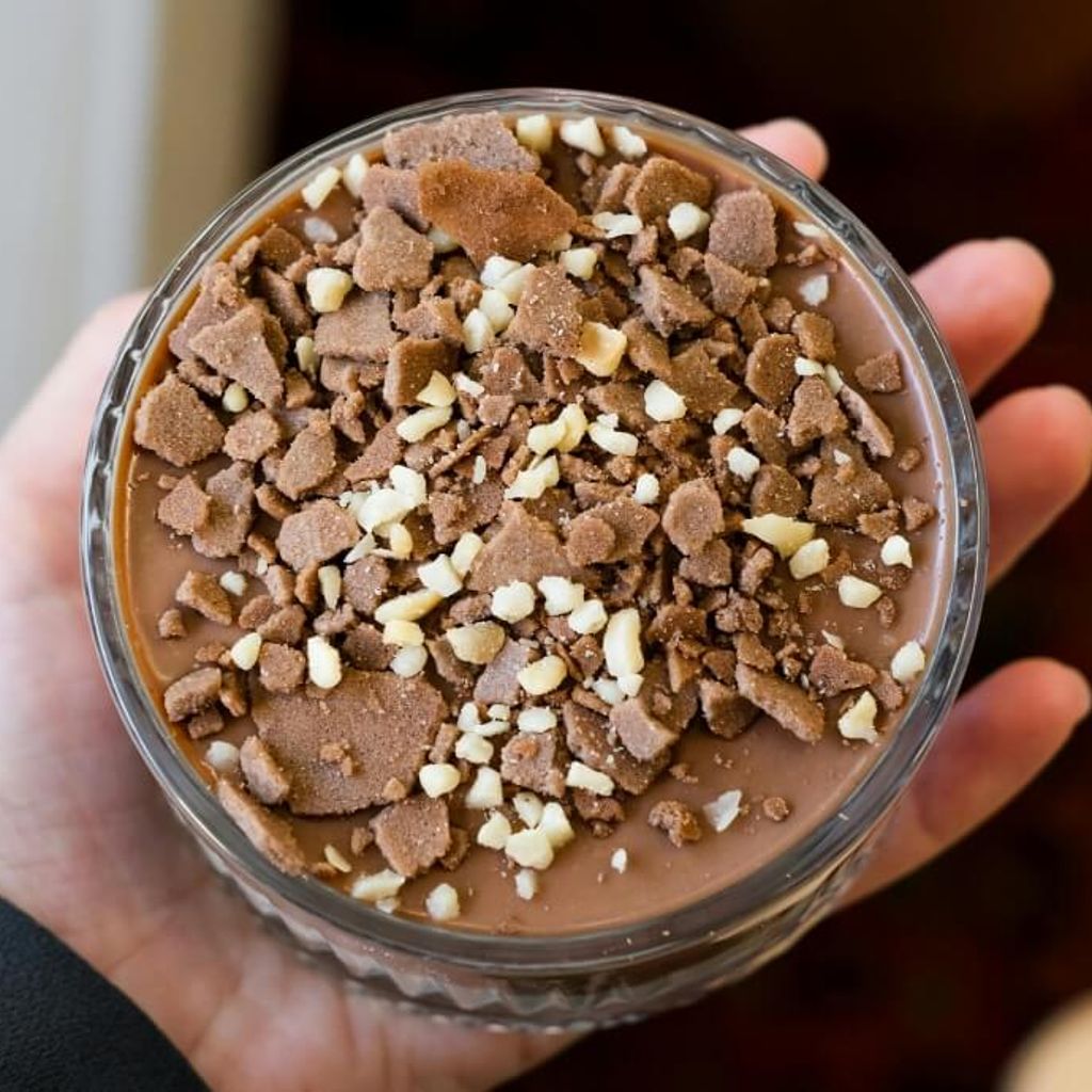A generous serving of the smoked sea salt and caramel chocolate pots topped with hobnob crumbs and chocolate shavings.