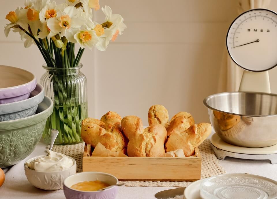 Lemon Easter bunny-shaped scones served warm with lemon curd and whipped cream