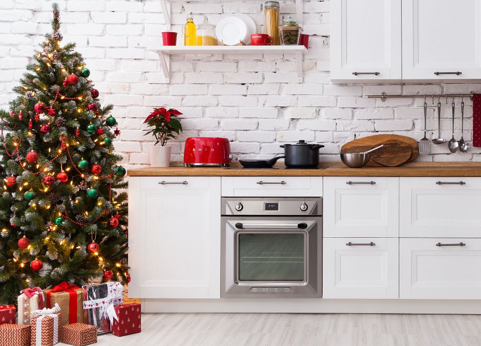 Cooking at Christmas with a Smeg oven next to a christmas tree