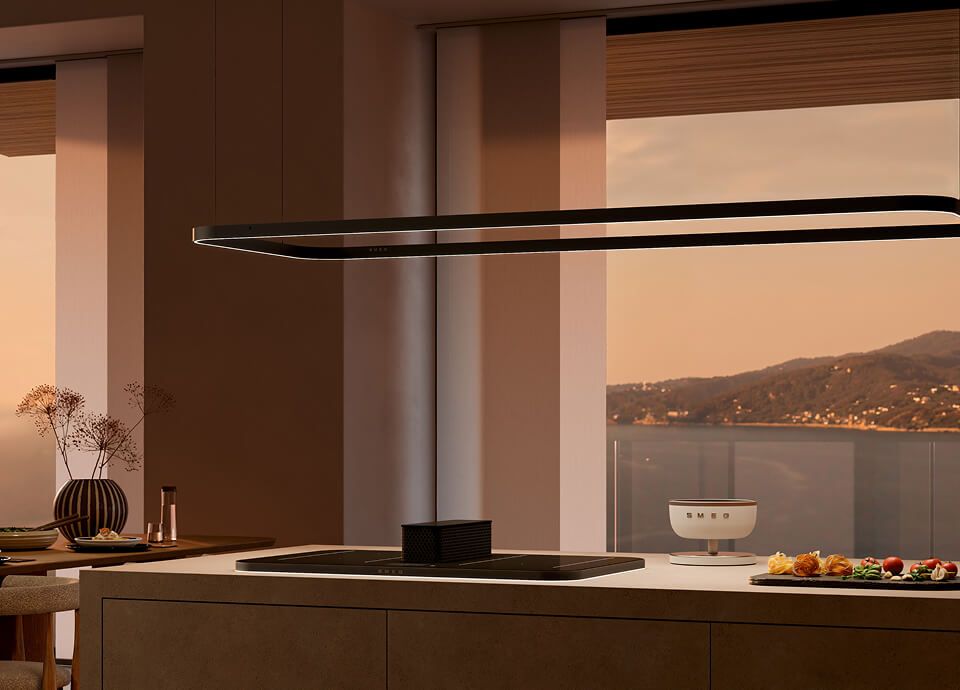 Elegant suspended lighting rails positioned above a kitchen island in a contemporary interior with warm tones and a scenic view