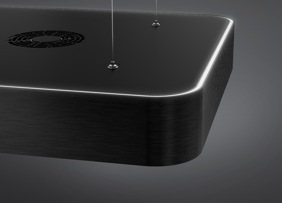 Pormenor de um exaustor Smeg Isola preto com ventilação circular superior, canto arredondado e iluminação LED perimetral integrada.