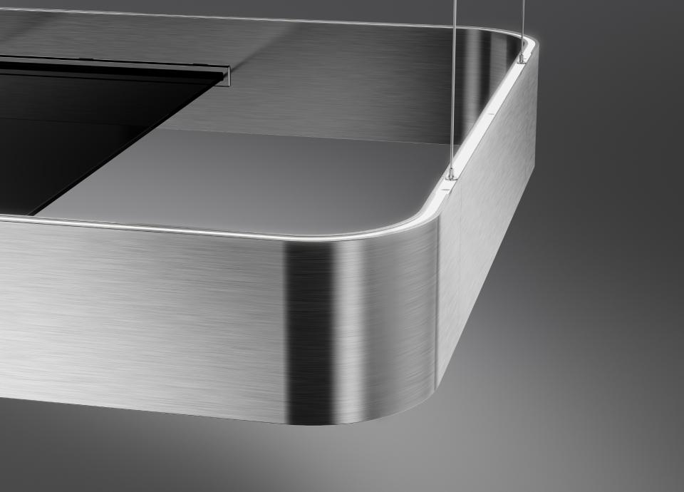Pormenor de um exaustor Smeg Isola em aço inox escovado com canto arredondado e faixa de luz LED integrada.
