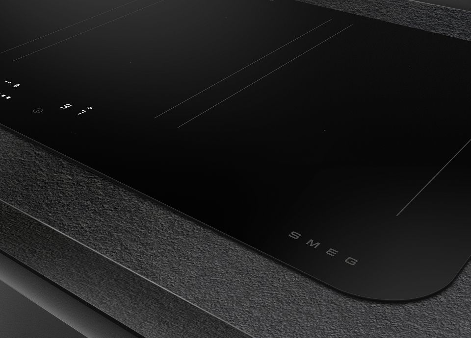 The image shows a closeup of a SMEG induction hob, with rounded corners