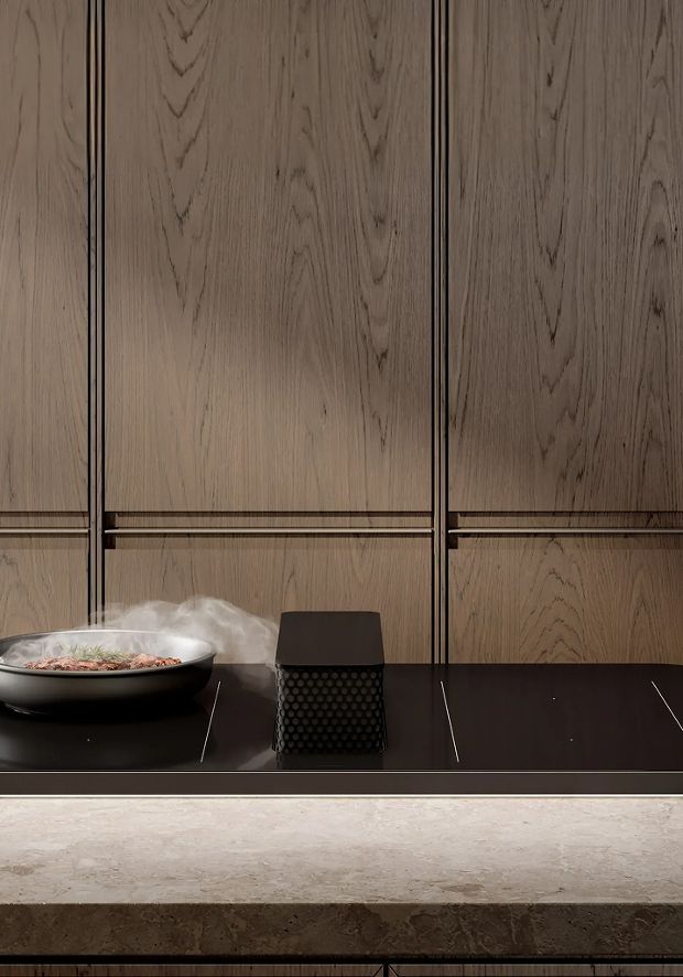 Modern kitchen interior featuring a minimalist black induction hoob with integrated into a counter, with matching textured wood wall panels.