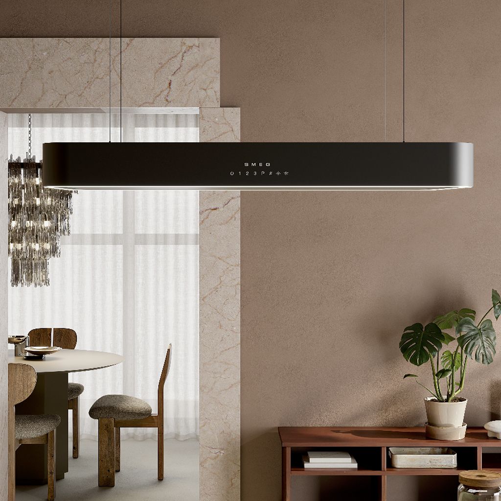 Black suspended  hood with a minimalist profile and integrated touch controls, hanging over a dining area with warm neutral decor.