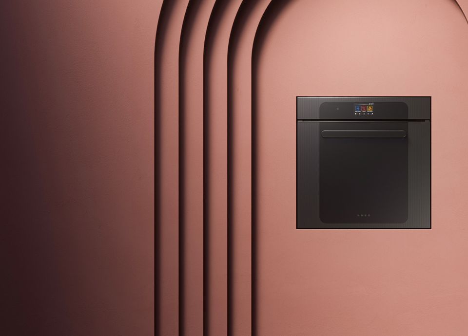 SMEG built-in oven with black glass front and electronic controls, shown against a decorative architectural background.