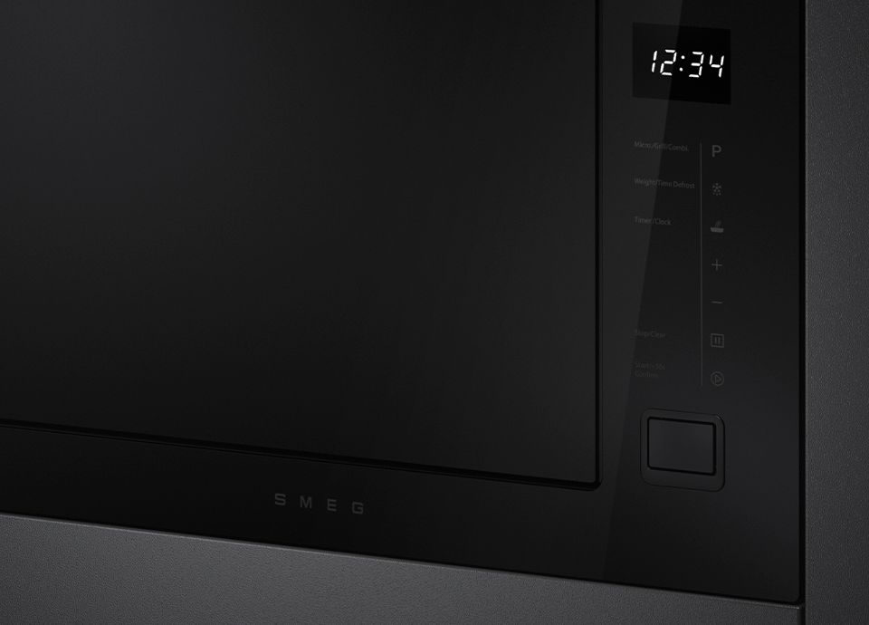 Grande plano do vidro preto Eclipse num microondas