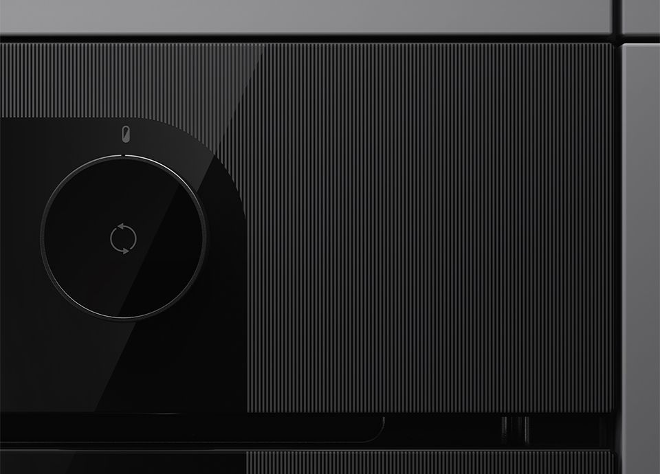 The image shows a closeup of a Musa oven, highlighting soft and rounded contours and matte and glossy surfaces