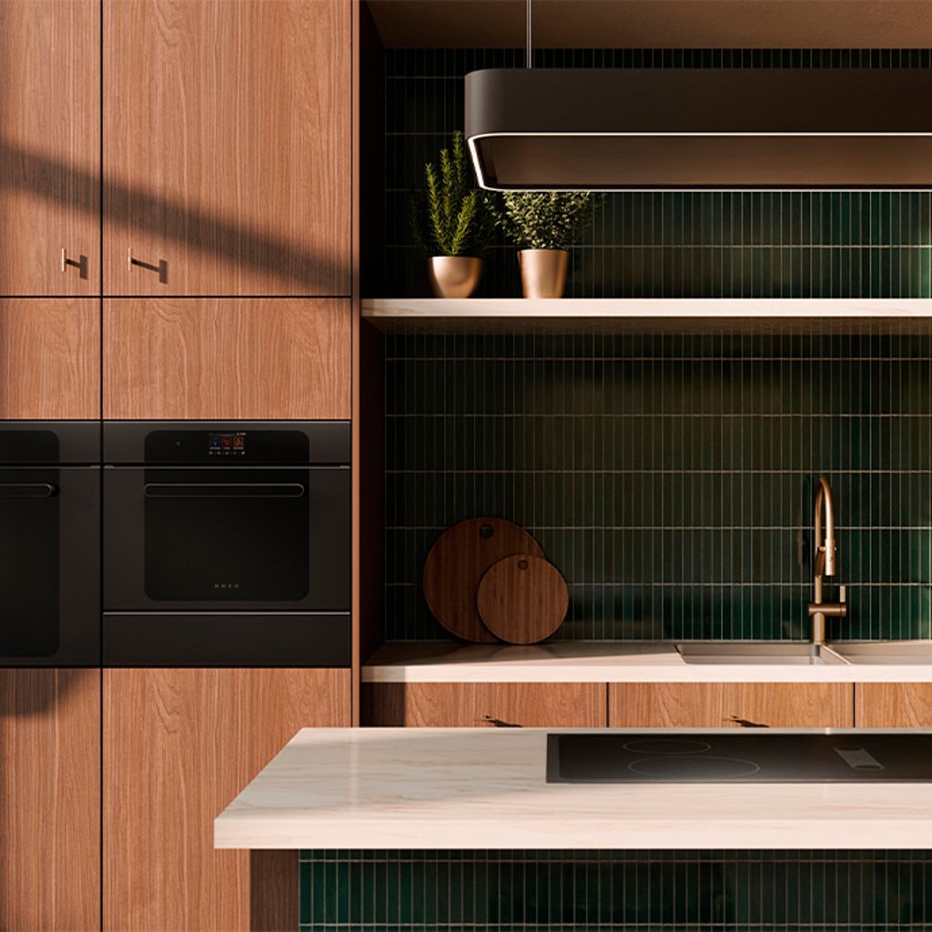 Closeup of a black induction hob on a greige kitchen countertop