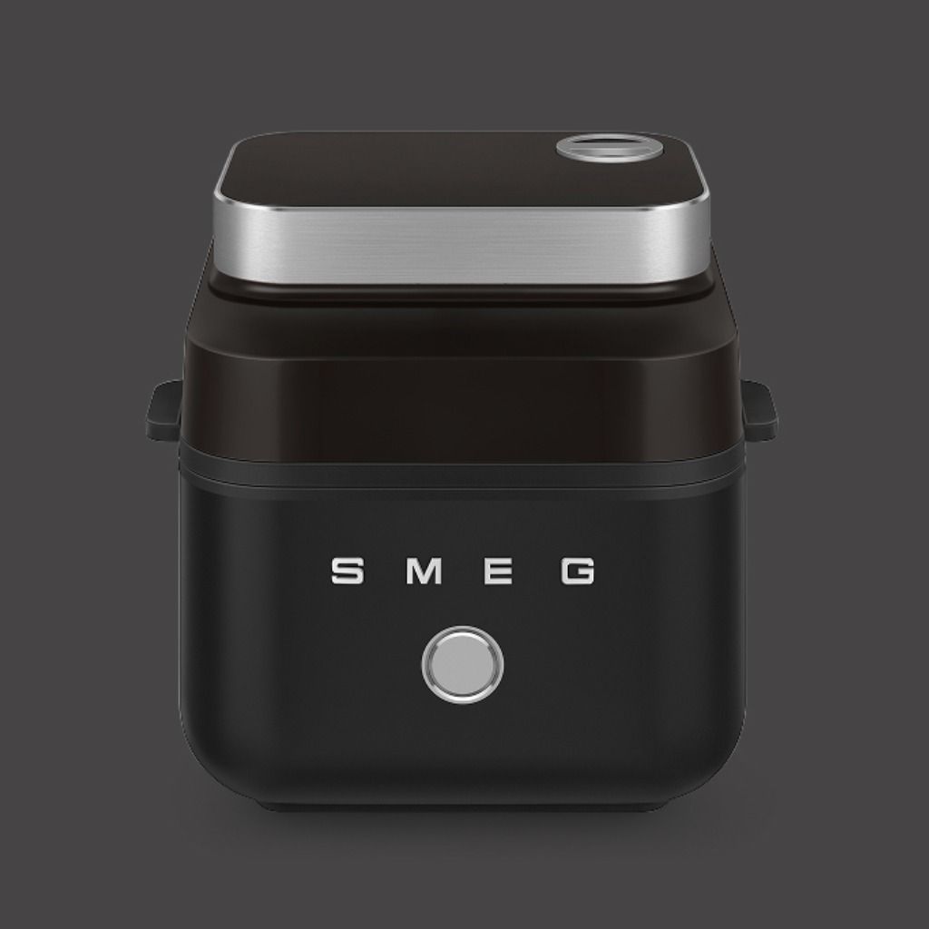 Black air fryer on a matching background.