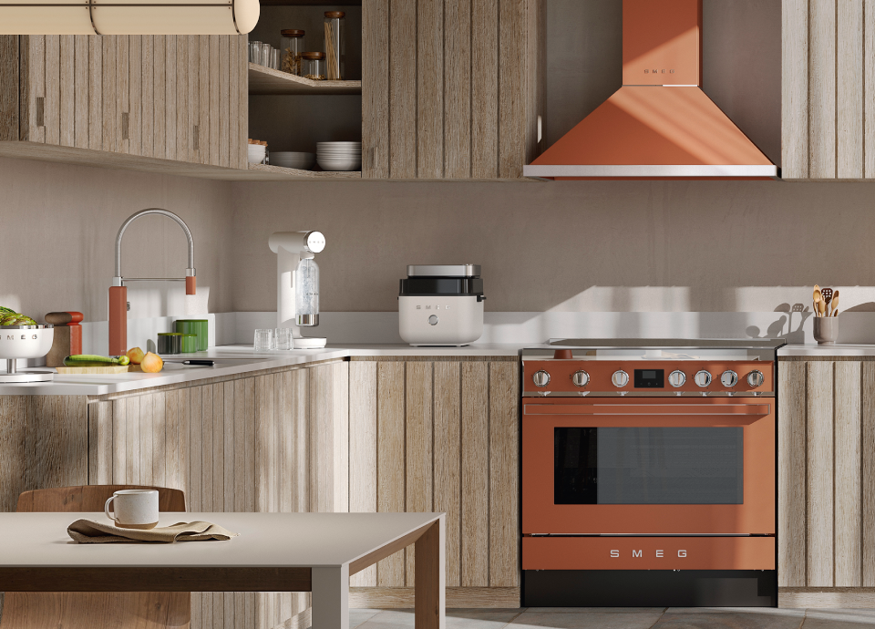 Smeg white air fryer on a countertop in a modern kitchen with wood cabinets, neutral tones and copper appliances