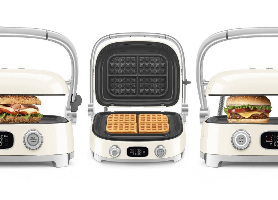 Tostadeira Multiuso Smeg a apresentar os programas predefinidos Panini, Waffles e Hambúrgueres.