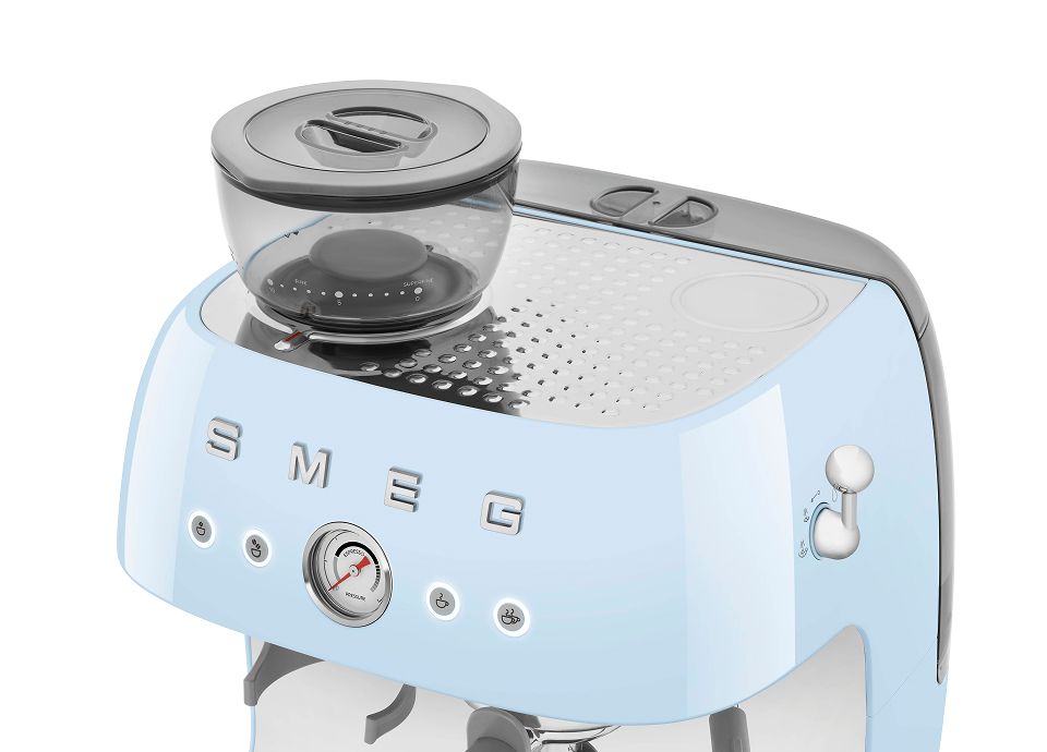 Pastel blue Smeg manual espresso coffee machine with built-in grinder, bean hopper, pressure gauge, and steam knob