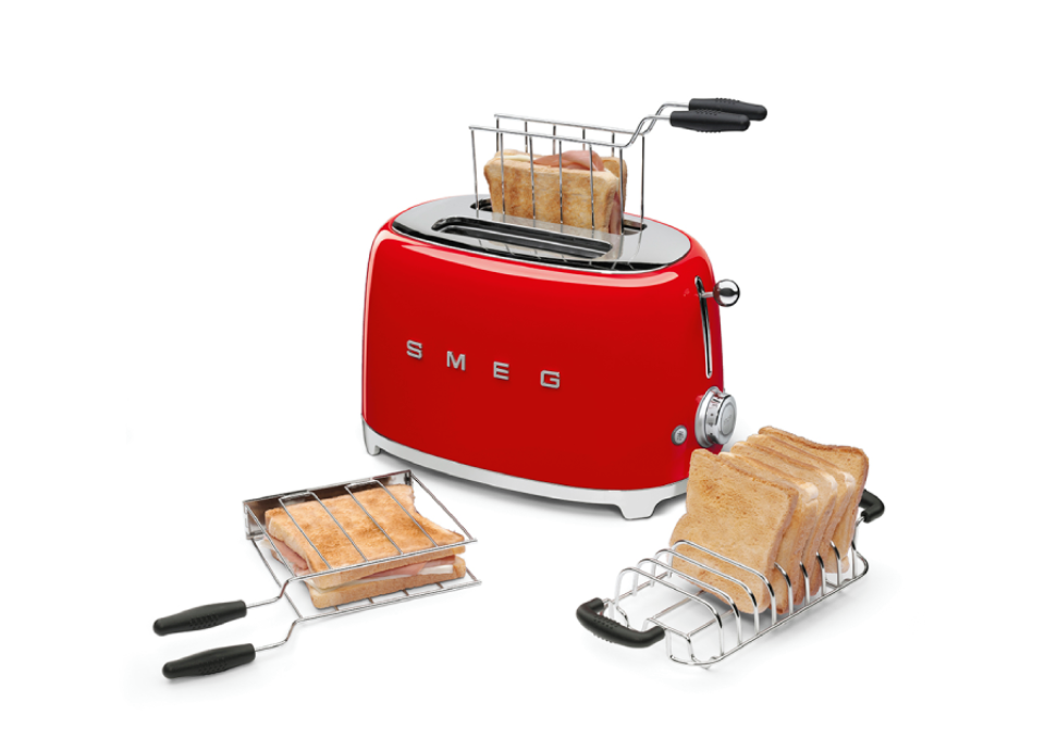 Red Smeg toaster with multiple toast racks and slices of bread, displayed on a white background