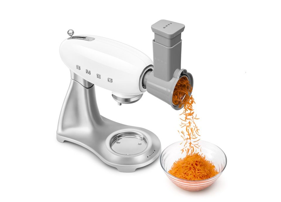 White SMEG Stand Mixer with stainless steel body and vegetable chopper accessory