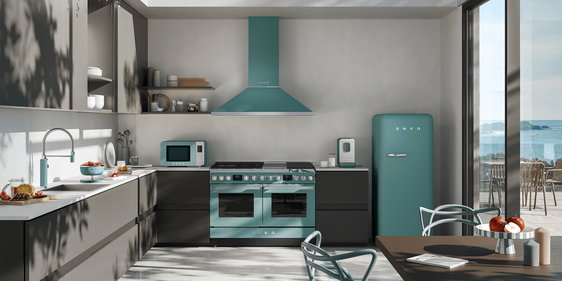 Modern kitchen interior featuring SMEG appliances with storm blue accents, including a cooker, extractor hood, and retro-style refrigerator, set against neutral cabinetry with natural light, plants, and a dining area.