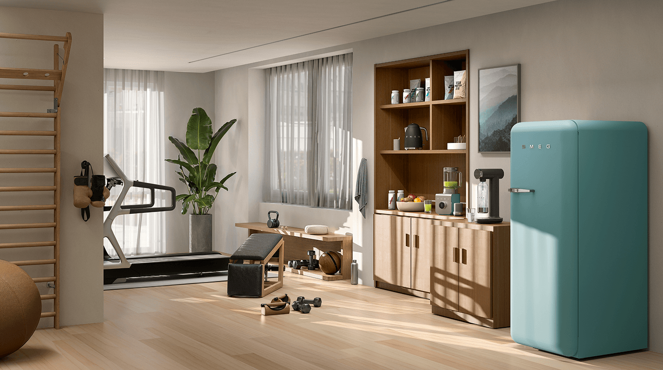 Bright multifunctional living space featuring SMEG appliances in storm blue finish, including a retro-style refrigerator and small countertop appliances on a wooden sideboard, set alongside a fitness area with gym equipment, light wood flooring, and large windows with sheer curtains.