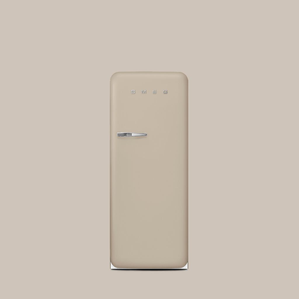 A Smeg 50s style refrigerator in the Moonlight colour, stands against a minimalist neutral wall.