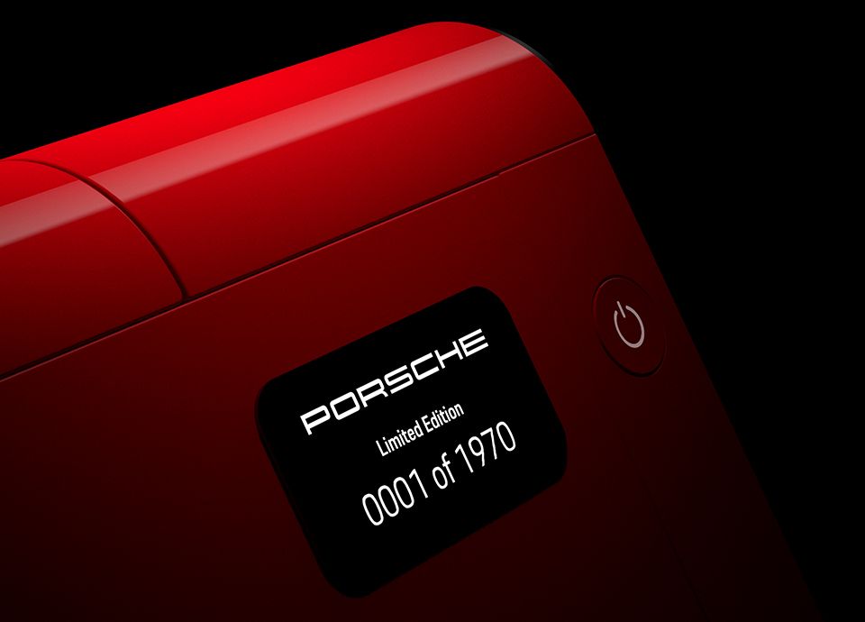 Black metal plate located on the side of the coffee machine, engraved with the product identification number.