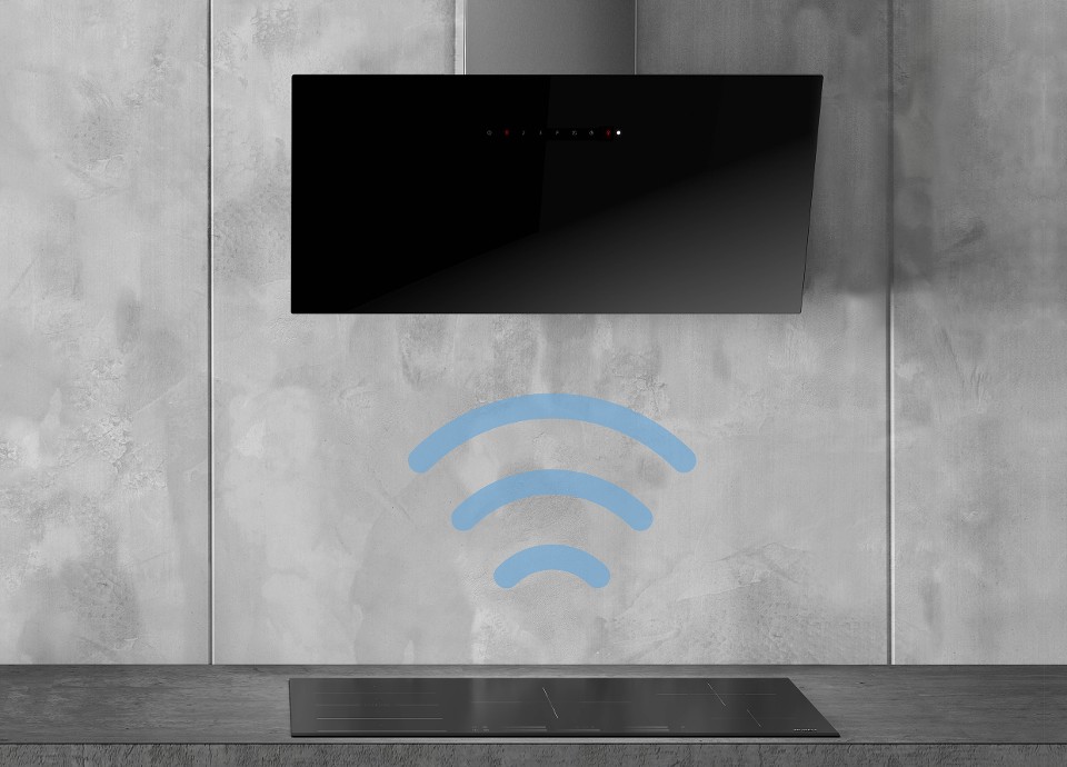 A black Induction hob and hood working together