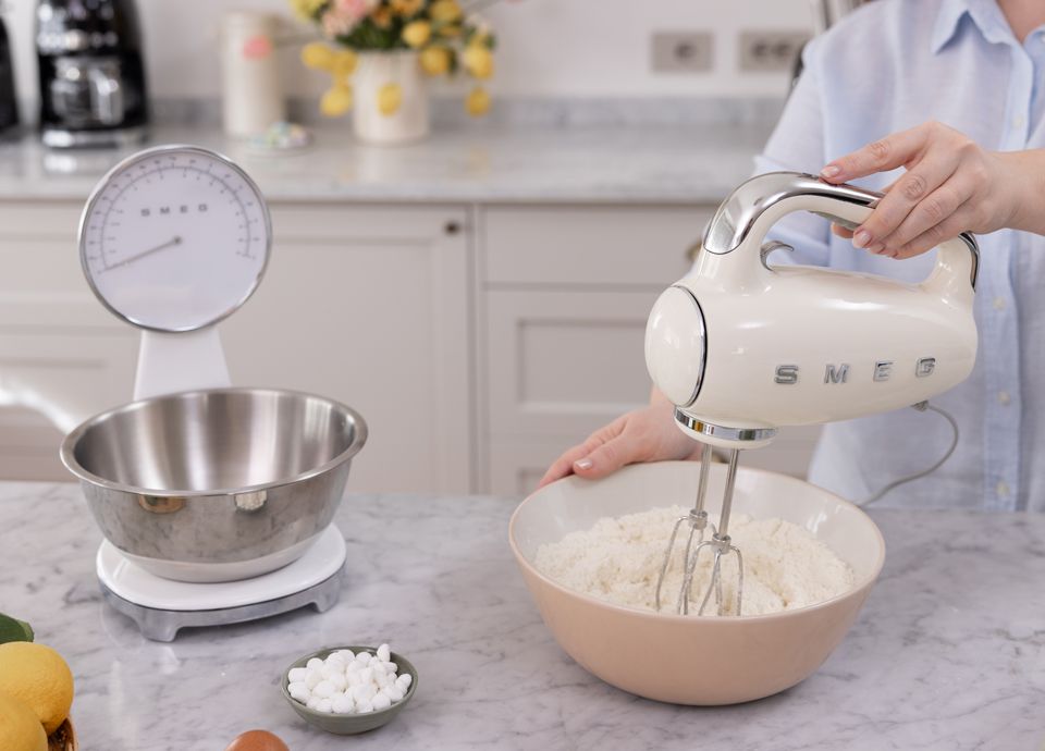 Mixing tart dough with a Smeg hand mixer in a kitchen