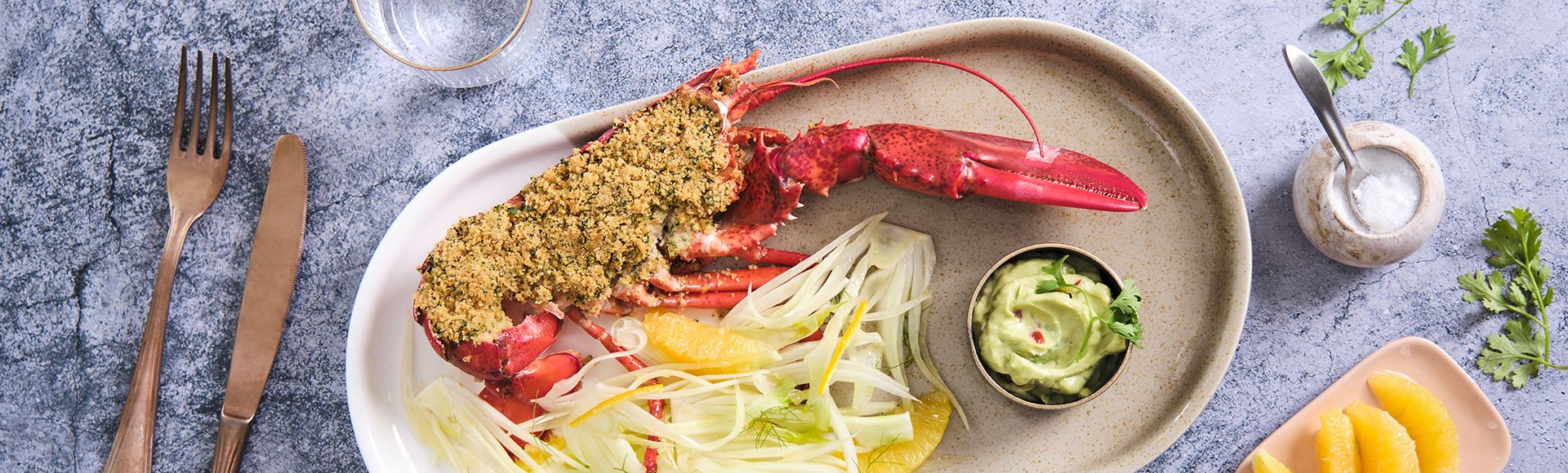 Lobster gratin and fennel salad with oranges and guacamole