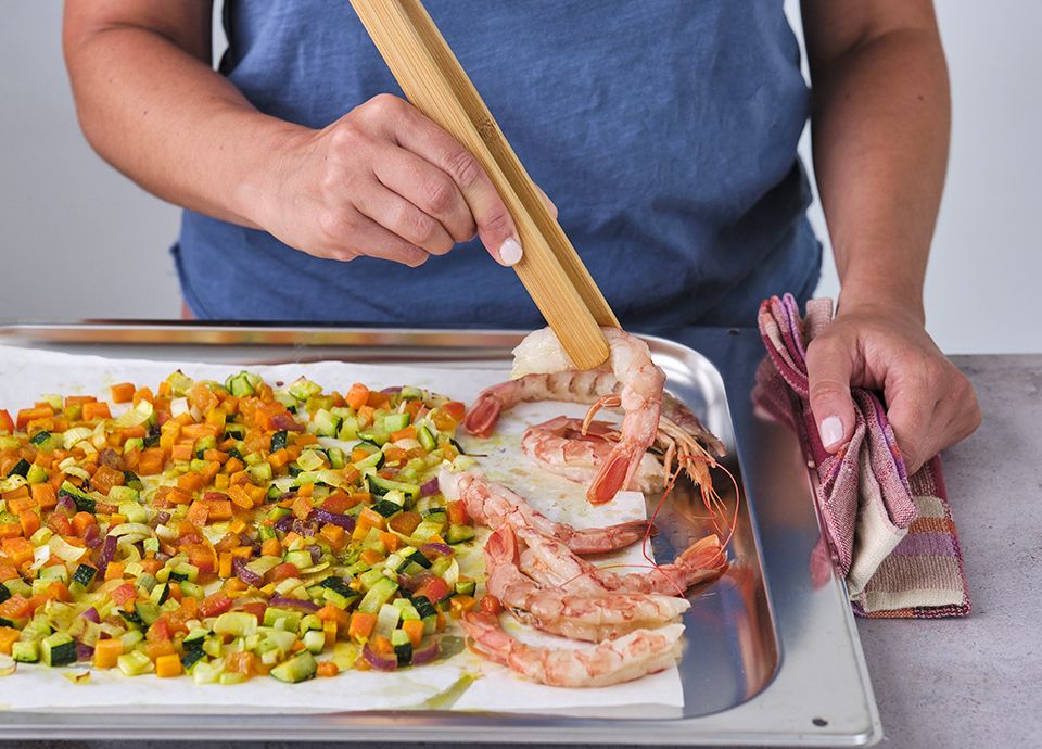 Step 3 - lay the prawns on the pan