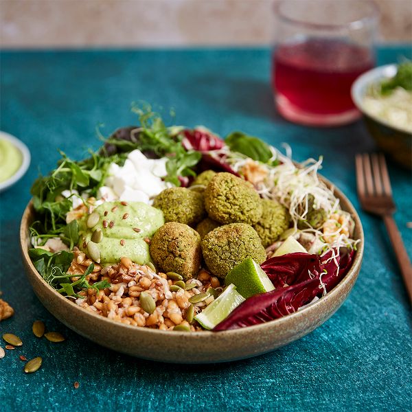 buddha-bowl-with-quinoa-patties-broccoli-stems-and-spinach
