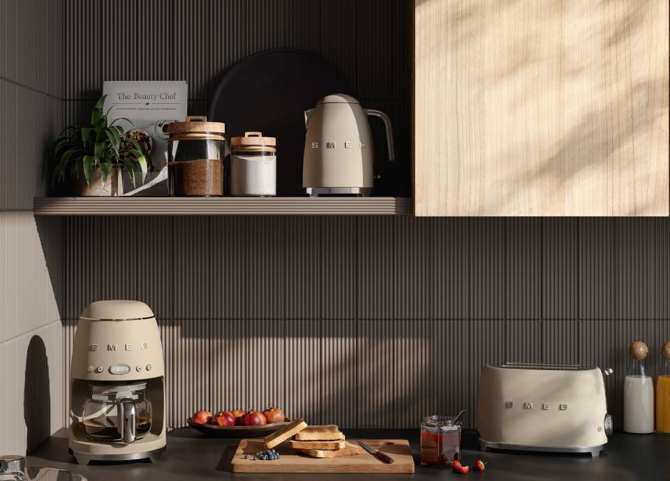 Moonlight Matt-finish coffee machine, kettle, and toaster in a modern kitchen with dark counters and a ribbed backsplash.