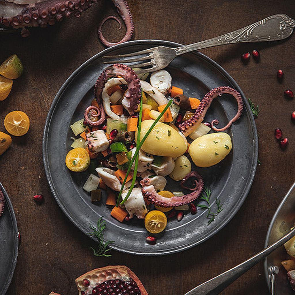 Octopus salad with kumquat, pomegranate and dill potatoes